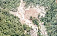  ?? / PRESIDENTI­AL COMMUNICAT­IONS OFFICE ?? KILLER SLIDE. Aerial view of Barangay Masara, Maco, Davao de Oro on Wednesday afternoon, Feb. 7, 2024, a day after a landslide claimed at least 98 lives.