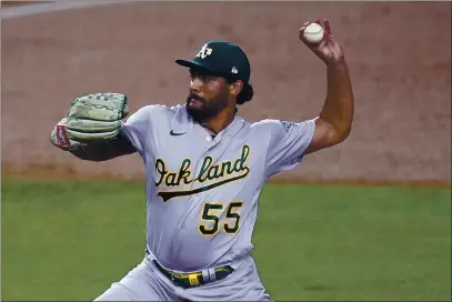  ?? MARCIO JOSE SANCHEZ — THE ASSOCIATED PRESS ?? Oakland Athletics starting pitcher Sean Manaea throws to a Los Angeles Dodgers batter during the first inning on Wednesday, in Los Angeles.