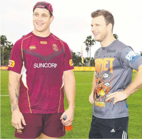  ?? Picture: AAP IMAGE ?? Titans star Jarrod Wallace (left) with boxer Jeff Horn at Queensland State of Origin training yesterday.