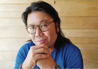  ?? GIANCARLO CIAMPINI ?? Kevin Kwan, author of the popular trilogy on the lifestyles of the rich and famous in Singapore.