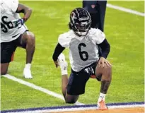  ?? JOSE M. OSORIO / CHICAGO TRIBUNE ?? Bears cornerback Kyler Gordon stretches at rookie minicamp Friday at Halas Hall in Lake Forest.