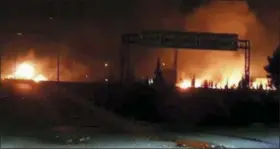  ?? SANA VIA AP ?? This photo released on Wednesday by the Syrian official news agency SANA shows flames rising after an attack in an area known to have numerous Syrian army military bases in Kisweh, south of Damascus, Syria. Syrian state-run media said Israel struck a...