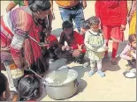  ?? SOURCED ?? ▪ Yashvir Singh’s daughter stands with plate in her hands.