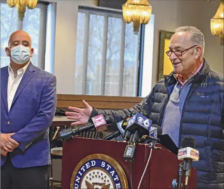  ?? Photos by Lori Van Buren / Times Union ?? Jaime Ortiz, left, chef and co-owner of Toro Cantina, listens as Senate Majority Leader Charles Schumer unveils a planned restaurant relief fund on Monday at the Wolf Road restaurant in Colonie.