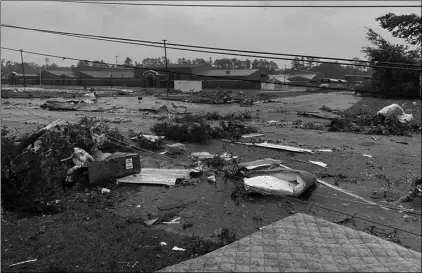  ?? Alicia Jossey via AP ?? This photo provided by Alicia Jossey shows debris covering the street in East Brewton, Ala., on on Saturday.