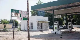  ?? — AFP ?? A picture taken in Bama, northeast Nigeria shows a fuel station destroyed by Boko Haram. The conflict with Boko Haram in northeast Nigeria has displaced more than 2.6 million people.