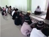  ?? PICTURES: ASSOCIATED PRESS ?? Former radical preacher Khairul Ghazali, right, delivers a sermon following afternoon prayers at Al-Hidayah Islamic Boarding School in Sei Mencirim, North Sumatra, Indonesia. Ghazali set up the school for the sons of Islamic militants, whose fathers...