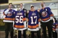  ?? KEVIN P. COUGHLIN — OFFICE OF GOVERNOR ANDREW M. CUOMO VIA AP ?? In this photo provided by the Office of New York Governor Andrew M. Cuomo, Gov. Cuomo, center left, poses with performer and Long Island native Billy Joel, center right, at a news conference at Belmont Park in Elmont, N.Y., Wednesday.