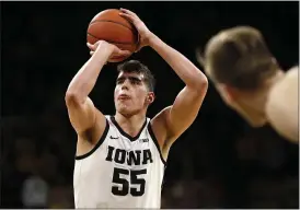  ?? CHARLIE NEIBERGALL — THE ASSOCIATED PRESS ?? Iowa center Luka Garza shoots a free throw during a game against Purdue in Iowa City, Iowa on March 3.