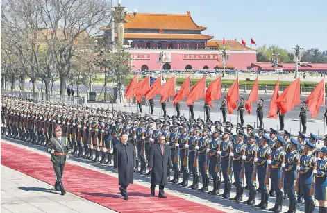  ??  ?? Micronesia’s President Peter Christian (right) reviews an honour guard with his Chinese counterpar­t Xi Jinping outside the Great Hall of the People in Beijing. Christian was welcomed by Xi after attending the Boao Forum for Asia Annual Conference.— AFP...