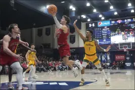  ?? JEFF CHIU — THE ASSOCIATED PRESS ?? Saint Mary’s guard Aidan Mahaney (20) shoots in front of San Francisco guard Malik Thomas (1) during the first half in Moraga on Tuesday.