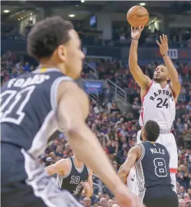  ?? — USA Today Sports ?? Toronto Raptors’ Norman Powell (24) shoots the ball against the San Antonio Spurs at Air Canada Centre.