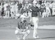  ?? Martin Dokoupil / Associated Press ?? Jordan Spieth, left, and Rory McIlroy fell off the leader board during Friday’s second-round play at the European Tour’s Abu Dhabi Championsh­ip.