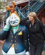  ??  ?? DOUBLE ACT: Bridget poses with a Halloween ghost at Disneyland Paris