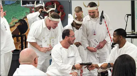  ??  ?? Pathway to Freedom program members put on a morality play for other inmates and their families at the Arkansas Department of Correction’s Hawkins Unit in Wrightsvil­le on Dec. 8.