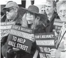  ??  ?? Outside the Consumer Financial Protection Bureau. MANUEL B. CENETA, AP