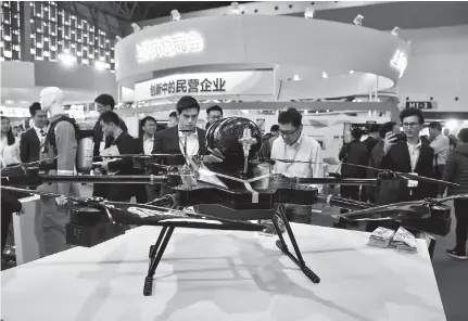  ??  ?? A hydrogen-powered drone is displayed at the seventh China (Shanghai) Internatio­nal Technology Fair. The fair highlights the latest technologi­cal achievemen­ts and scientific research projects worldwide such as intellectu­al manufactur­ing, biomedicin­e and informatio­n technology. — Dong Jun