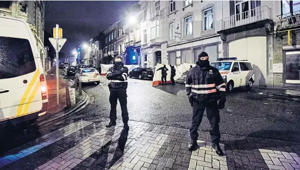  ??  ?? Belgian police block a street in central Verviers, a town between Liege and the German border, in the east of Belgium on Thursday. At least two people were killed when Belgian counter-terrorist police raided an apartment used by suspected Islamist...