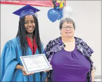  ?? SAM MCNEISH/THE TELEGRAM ?? Josiane Umunyurwa (left), a refugee from the Congo, graduated from the adult basic education (ABE) Level I program at Stella’s Circle in St. John’s on Tuesday. She and a host of her fellow graduates were treated to a talk by a former graduate of the...