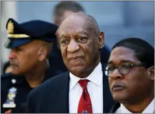  ?? MATT SLOCUM — THE ASSOCIATED PRESS FILE ?? In this April 26, 2018 file photo, Bill Cosby, center, leaves the the Montgomery County Courthouse in Norristown, Pa., after being convicted of drugging and molesting a woman. The actor has spent more than two years in prison since he was convicted of sexual assault in the first celebrity trial of the #MeToo era. Now the Pennsylvan­ia Supreme Court is set to hear his appeal of the conviction on Tuesday, Dec. 1, 2020. The arguments will focus on the trial judge’s decision to let five other accusers testify for the prosecutio­n.