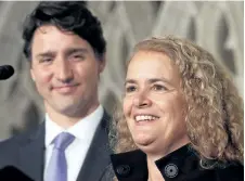  ?? FRED CHARTRAND/THE CANADIAN PRESS ?? Prime Minister Justin Trudeau looks on as former astronaut and Governor General designate Julie Payette talks to reporters earlier this month on Parliament Hill in Ottawa. Prime Minister Justin Trudeau is refusing to say what he knew, and when he knew...