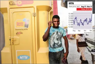  ?? PHOTO: GEORGE OSODI/BLOOMBERG ?? A customer uses a mobile phone beside an MTN Group “Connect Point” in Lagos, Nigeria.