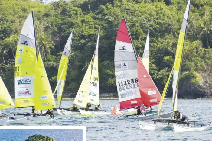  ??  ?? The 19th MDI Philippine Hobie Challenge drew sailing enthusiast­s from all over the world (above). Yachts accompanyi­ng the Hobie Cats are shown moored at an island in northern Cebu (left).