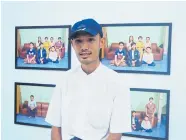  ??  ?? BELOW Sai Minn Thein, a former political prisoner, stands before his photo series of a family, part of an exhibition titled “Beyond the Prison Gate”, at the Healthcare Centre for Political Prisoners in Yangon.