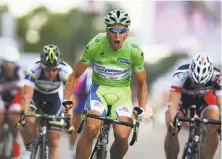  ?? Bryn Lennon / Getty Images ?? Slovakian rider Peter Sagan, competing for the LiquigasCa­nnondale team, wins Stage 2 of the Tour de France.