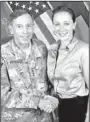  ?? Associated Press File Photo ?? Gen. Davis Petraeus, left, shakes hands with Paula Broadwell, co-author of “All In: The Education of General David Petraeus.”