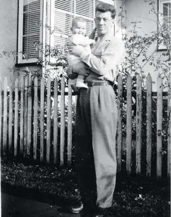  ??  ?? Harold Todd holds his young son Douglas in front of the family home in 1954. That year, the university-educated accountant was admitted to Riverview Hospital in Coquitlam after showing signs of “paranoia” and “grandiosit­y.”