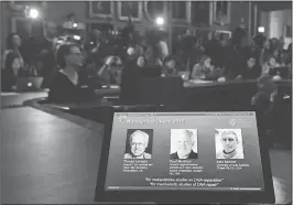  ??  ?? The portraits of the winners of the Nobel Prize in Chemistry 2015 (L-R) Sweden's Tomas Lindahl, Paul Modrich of US and Turkish-American Aziz Sancar are displayed on a giant screen during a press conference on October 7, 2015 at the Royal Swedish...