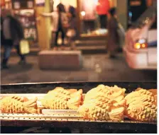  ??  ?? The fish-shaped pastry ‘bungeoppan­g’ are stuffed with sweetened red bean paste.