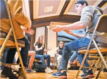  ?? STAFF PHOTOS BY TIM BARBER ?? Inside St. Paul’s Episcopal Church Sunday afternoon, GPS student Nikki Goldbach, back left, directs during a breakout session of students discussing plans for the National Student Walkout today. Katelyn Burns, back right, is a student at Sequoyah...