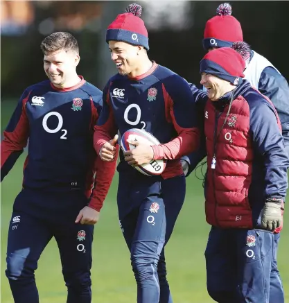 ??  ?? Carry on Eddie: Jones with England players Ben Youngs and Anthony Watson during the Six Nations