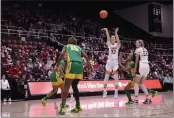  ?? JOSIE LEPE — THE ASSOCIATED PRESS ?? Stanford guard Hannah Jump (33) shoots a 3-point basket during the second half of a game against Oregon center Phillipina Kyei (15), Sunday, in Stanford.