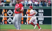  ?? MATT SLOCUM / AP ?? Philadelph­ia Phillies’ Kyle Schwarber, right, rounds the bases after hitting a home run against Los Angeles Angels pitcher Chase Silseth during the first inning Friday in Philadelph­ia.