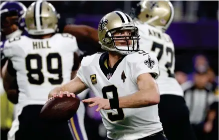 ?? (Photo by Jeff Roberson, AP) ?? New Orleans Saints quarterbac­k Drew Brees (9) throws against the Minnesota Vikings during the first half of last Sunday's game.