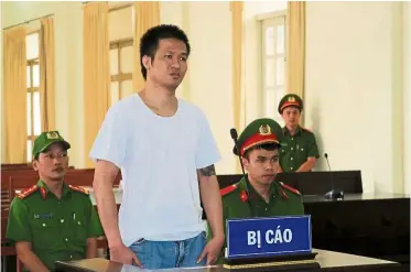  ?? — AFP ?? Found guilty: Vuong hearing the verdict during his trial in Lam Dong province.
