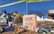  ?? Jason Connolly AFP/Getty Images ?? A MAKESHIFT memorial outside Club Q in Colorado Springs, Colo., where five people were killed.