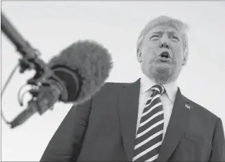  ?? AP PHOTO ?? President Donald Trump speaks to media after a campaign rally before boarding Air Force One at Elko Regional Airport, Saturday, in Elko, Nev., en route to Washington.