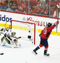  ?? (Reuters) ?? WASHINGTON CAPITALS forward Tom Wilson (right) celebrates after scoring a first-period goal past the Vegas Golden Knights’ Marc-Andre Fleury during the Caps’ 6-2 home victory over the Knights on Monday night to take a 3-1 lead in the best-of-seven...