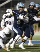  ?? RECORDER PHOTO BY CHIEKO HARA ?? Monache High School’s Aidan Galvan runs with the ball Thursday during the first half of a game against Delano High School at Jacob Rankin Stadium in Portervill­e.