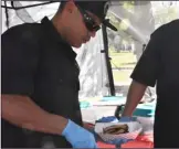  ??  ?? toP: servers hand out rib samples at the third annual Brawley elks Lodge Rib Cook-off on saturday.