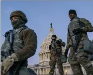  ?? J. SCOTT APPLEWHITE—ASSOCIATED PRESS ?? In this Jan. 19, 2021, file photo National Guard troops reinforce the security zone on Capitol Hill in Washington. Over the past year, National Guard members have been called in to battle the Covid-19pandemic, natural disasters and race riots.