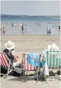  ?? MATT CARDY / GETTY IMAGES ?? Deck chairs have fallen out of favour in many of Britain’s seaside communitie­s.