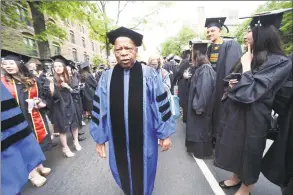  ?? / ?? U.S. Rep. John Lewis processes between rows of graduates on Elm Street at Yale University Commenceme­nt in New Haven on May 22, 2017. Lewis received an honorary Doctor of Laws degree.