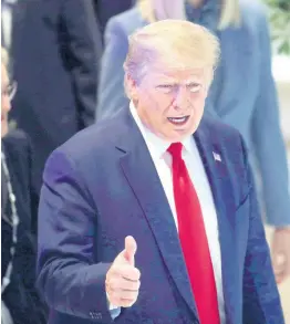  ?? AP ?? US President Donald Trump flashes a thumbs-up as he arrives at the World Economic Forum in Davos, Switzerlan­d, on Wednesday. The 50th annual meeting of the forum is taking place in Davos from January 21 until January 24.