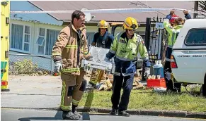  ?? JASON DORDAY/STUFF ?? Emergency services attend a trench collapse where a man was seriously injured in New Windsor Drive, Auckland, on Thursday.
