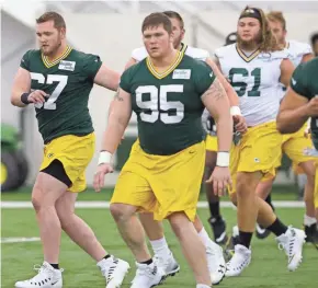  ?? MARK HOFFMAN / MILWAUKEE JOURNAL SENTINEL ?? Defensive end Conor Sheehy (left) is one of two former Wisconsin players at the rookie orientatio­n.